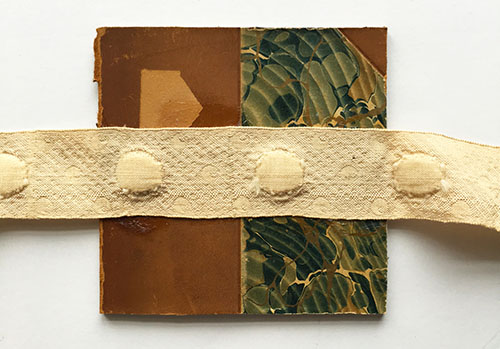 Ribbon glued to the back cover of an accordion book